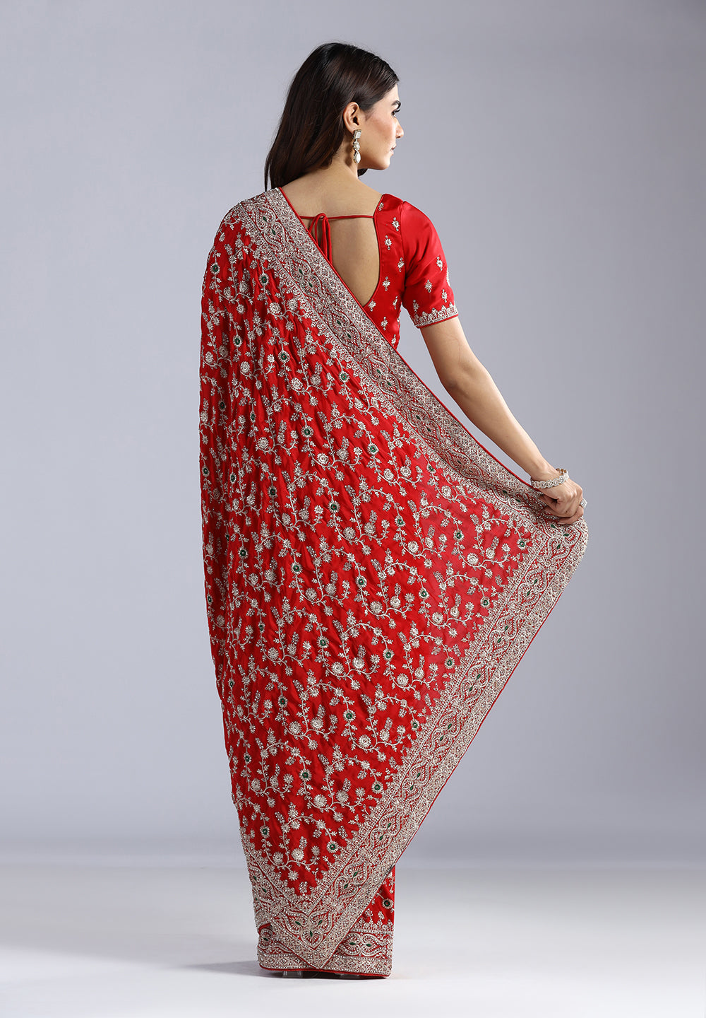 Crepe Saree Adorned with Shimmering Swarovski Crystals and Traditional Zari Artistry